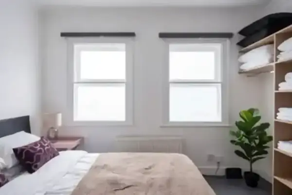 Bespoke secondary glazing in a bright, modern bedroom, showing how slimline profiles integrate into contemporary interiors for a quiet, energy-efficient sleeping environment.